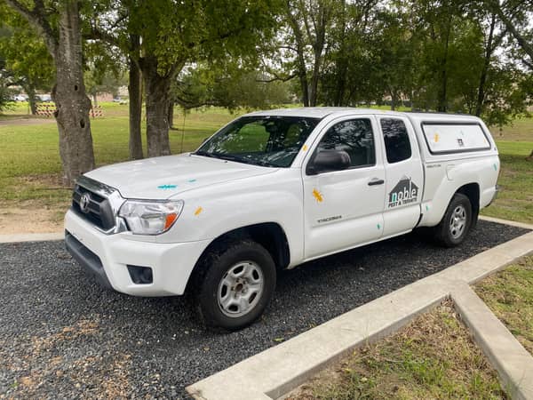 Noble Pest & Termite branded service truck parked on-site in Houston